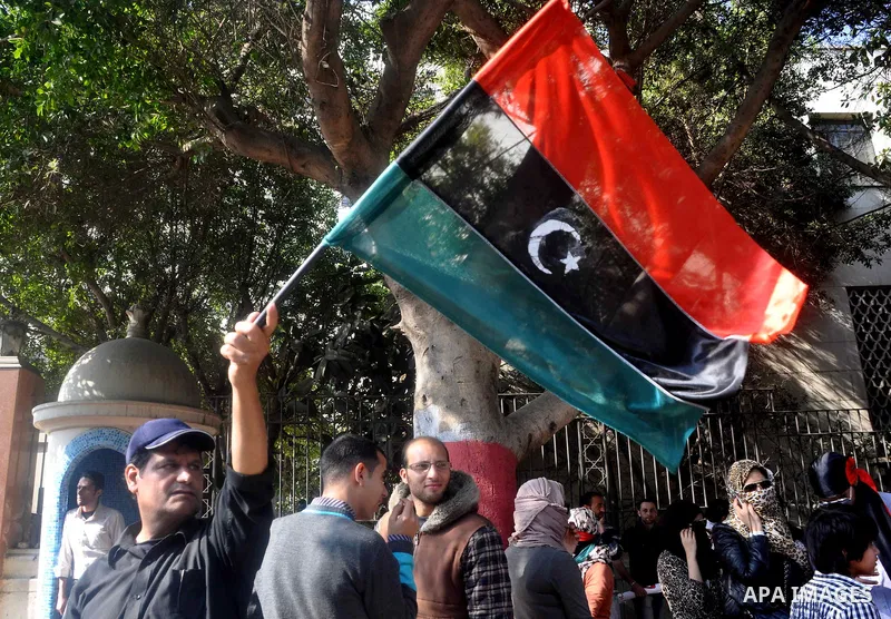 Libyans living in Egypt demonstrate against the Libyan leader Muammar Gaddafi forces and in support of rebels, outside the Arab League headquarters in Cairo, Egypt Sunday, March 27, 2011. Forces loyal to Libyan leader Mu...