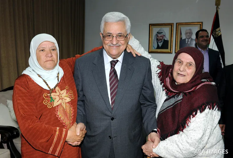 Palestinian President Mahmoud Abbas (Abu Mazen) meets with the Mothers Zakyia Zaid and Farsakha Al deik in west bank city of Ramallah March,28,2011 Photo by Thaer Ganaim