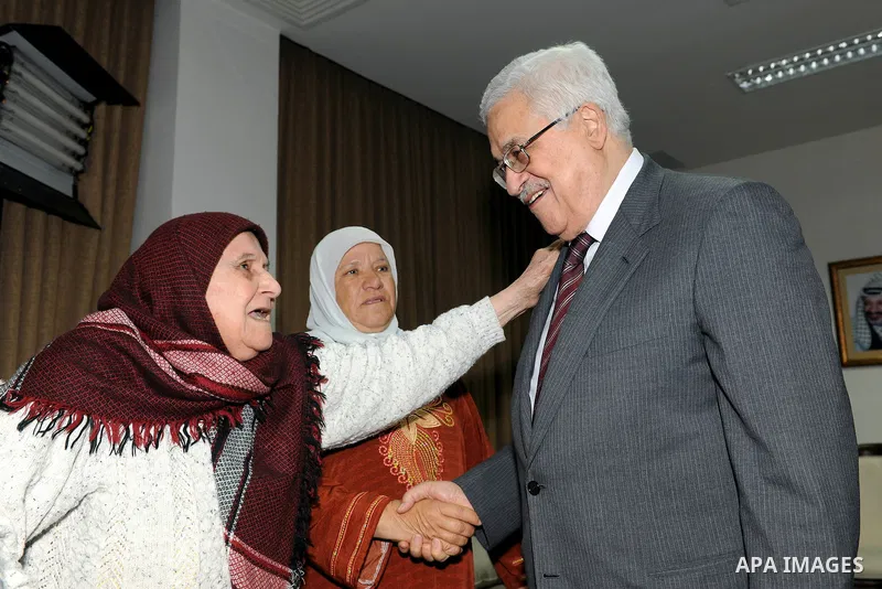 Palestinian President Mahmoud Abbas (Abu Mazen) meets with the Mothers Zakyia Zaid and Farsakha Al deik in west bank city of Ramallah March,28,2011 Photo by Thaer Ganaim