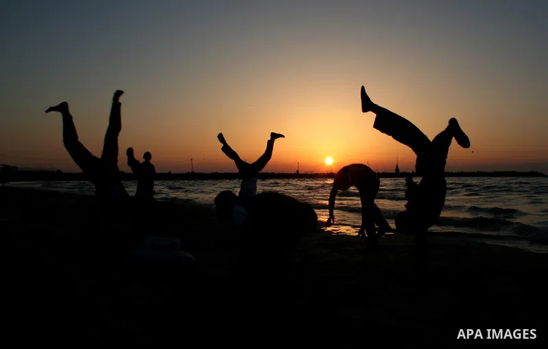 Palestinian youths practice jumping on the beach in Gaza City, on March 28, 2011 as they enjoy their free time. Photo by Mahmoud Nassar