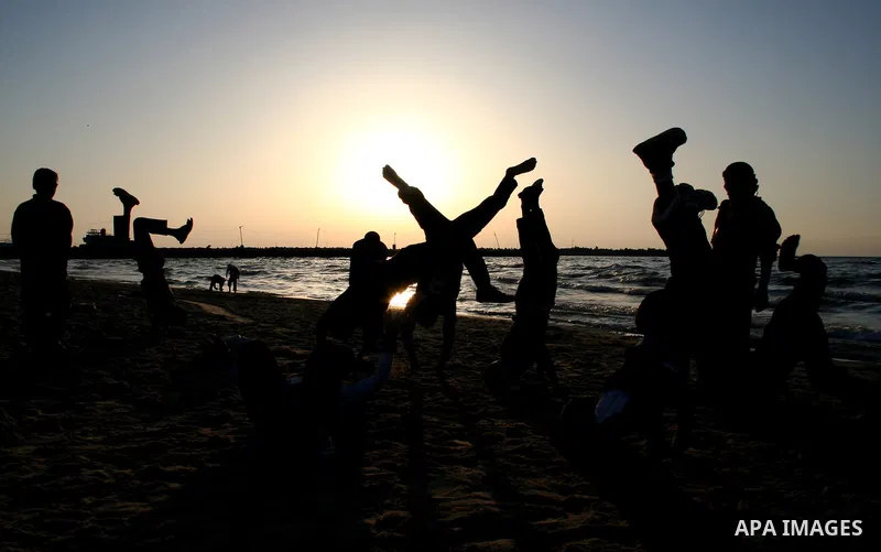 Palestinian youths practice jumping on the beach in Gaza City, on March 28, 2011 as they enjoy their free time. Photo by Mahmoud Nassar