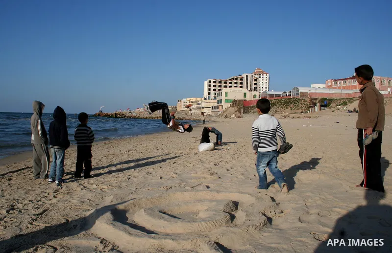 Palestinian youths practice jumping on the beach in Gaza City, on March 28, 2011 as they enjoy their free time. Photo by Mahmoud Nassar
