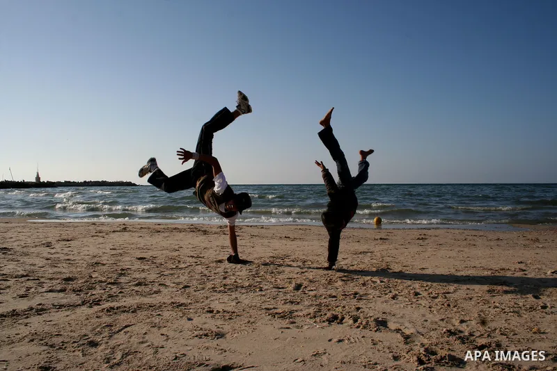 Palestinian youths practice jumping on the beach in Gaza City, on March 28, 2011 as they enjoy their free time. Photo by Mahmoud Nassar