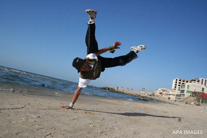 Palestinian youths practice jumping on the beach in Gaza City, on March 28, 2011 as they enjoy their free time. Photo by Mahmoud Nassar