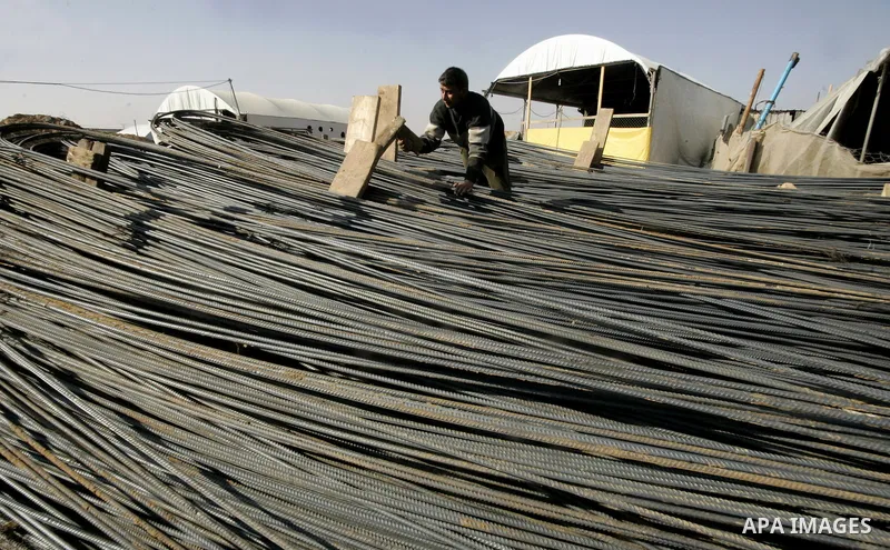 Palestinian man assembles iron coming from a tunnel used for smuggling goods into the Gaza Strip, which links Egypt to the southern Gaza town of Rafah, on March 29, 2011. Underground tunnels located on the frontier betwe...