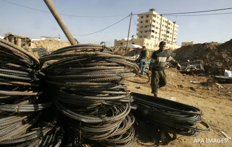 Palestinian man assembles iron coming from a tunnel used for smuggling goods into the Gaza Strip, which links Egypt to the southern Gaza town of Rafah, on March 29, 2011. Underground tunnels located on the frontier betwe...