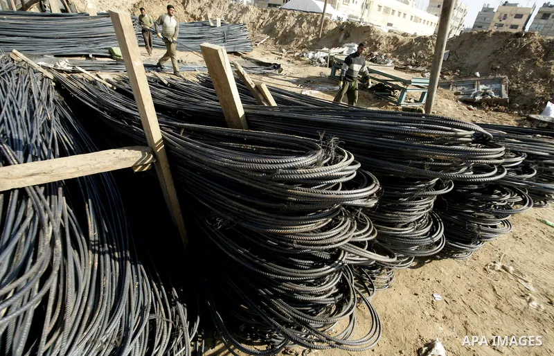 Palestinian man assembles iron coming from a tunnel used for smuggling goods into the Gaza Strip, which links Egypt to the southern Gaza town of Rafah, on March 29, 2011. Underground tunnels located on the frontier betwe...
