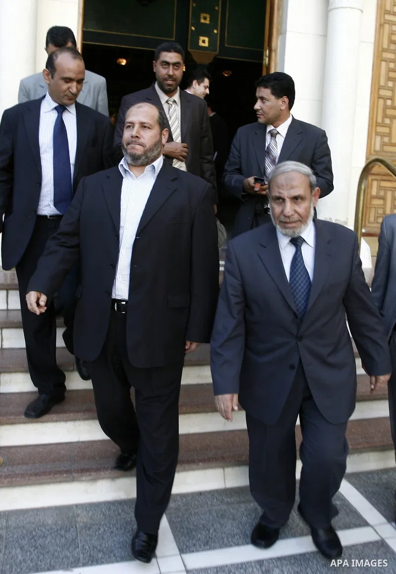 Palestinian Hamas' leader from Gaza, Mahmoud Zahar meets with the Arab League chief Amr Moussa during a press conference at the Arab League headquarters in Cairo, Egypt, Tuesday, March 29, 2011. Photo by Wissam Nassar