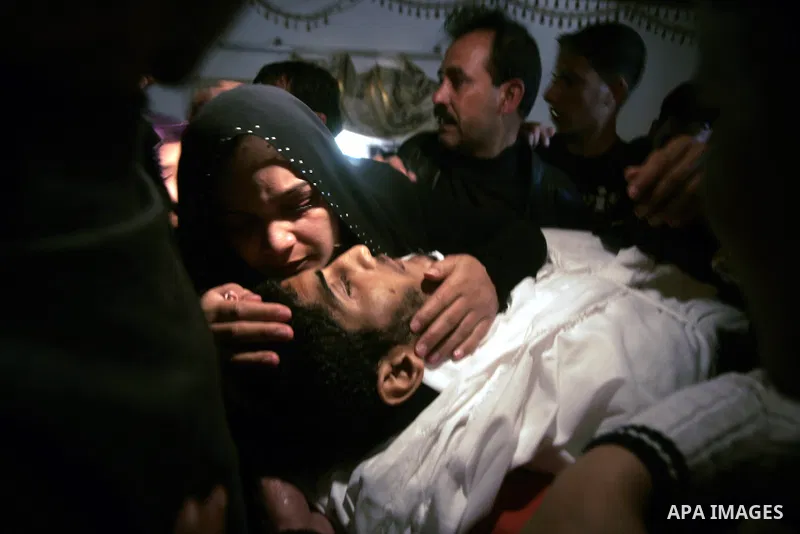 Palestinian women mourn during the funeral of Mohammed Muammar, who was killed during an Israeli air strike the previous day, in Khan Yunis, southern Gaza Strip, on March 30, 2011. The raid killed Muammar and wounded the...