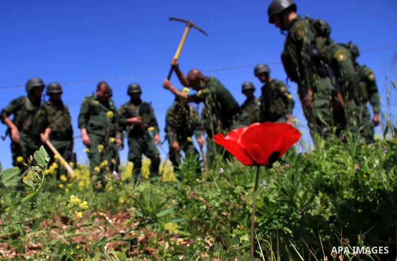 Palestinian security officers plant trees during an event marking Land Day, near the West Bank city of Nablus, Wednesday, March 30, 2011. Land Day commemorates the killing of six Arab citizens of Israel by the Israelis o...
