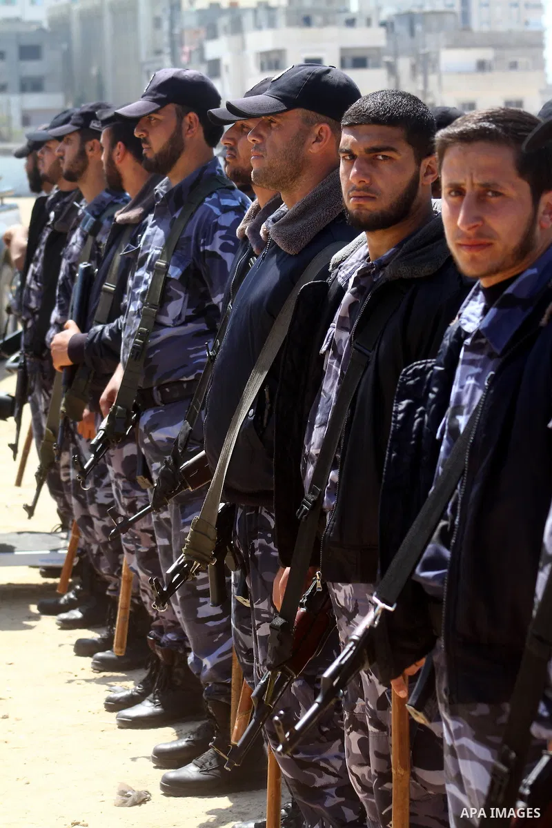 Palestinian Hamas security patrol in a street as Palestinian demonstrators take part in a protest calling for political unity between Gaza's Hamas rulers and the Fatah-dominated Palestinian Authority based in the West Ba...