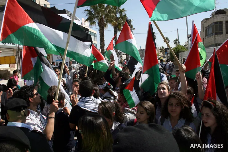 Palestinians take part in a rally marking the Land Day in the West Bank city of Ramallah, March 30, 2011. The Palestinians mark March 30 as the Land Day to remember the deaths of six Arabs in the hands of Israeli forces...