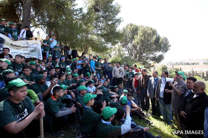 Sheikh Raed Salah and other Palestinians plant olive trees at the Mount of Olives, in East Jerusalem to mark the Land Day on March 30,2011, as hundreds of people across Israel and Palestinian territories were holding a s...