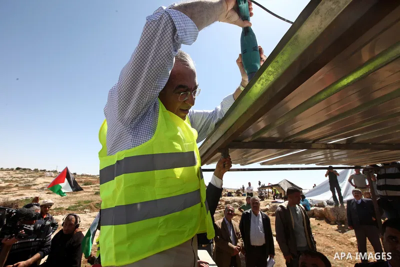 Palestinian prime minister Salam Fayyad visits the southern town of Yatta, near Hebron in the occupied West Bank, on March 30, 2011, as hundreds of people across Israel and Palestinian territories were holding a series o...