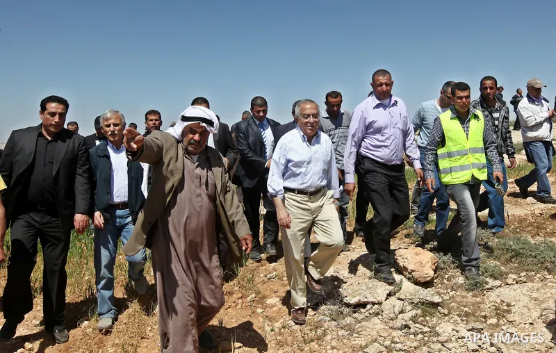 Palestinian prime minister Salam Fayyad visits the southern town of Yatta, near Hebron in the occupied West Bank, on March 30, 2011, as hundreds of people across Israel and Palestinian territories were holding a series o...