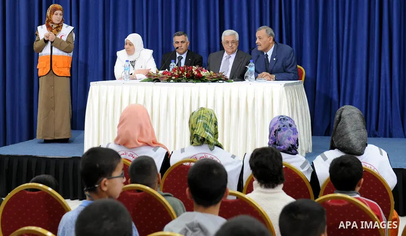 Palestinian President Mahmoud Abbas (Abu Mazen) meets with students of the full contact of the Red Crescent, west bank city of Ramallah March, 31,2011. photo by thaer ganaim