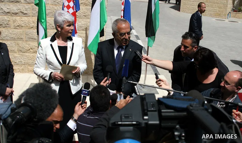 Palestinian Prime Minister Salam Fayyad and his Croatian counterpart Jadranka Kosor attend a joint press conference after their meeting in the West Bank city of Ramallah, on March 31, 2011. Photo by Issam Rimawi