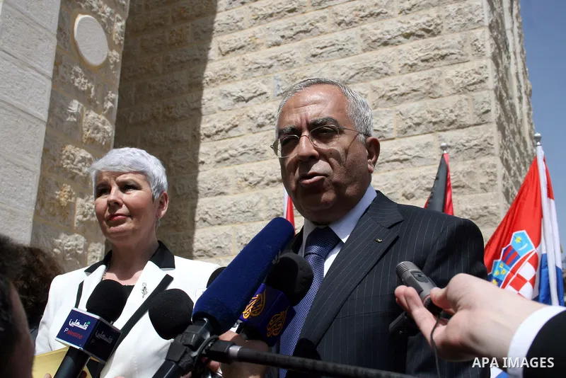 Palestinian Prime Minister Salam Fayyad and his Croatian counterpart Jadranka Kosor attend a joint press conference after their meeting in the West Bank city of Ramallah, on March 31, 2011. Photo by Issam Rimawi