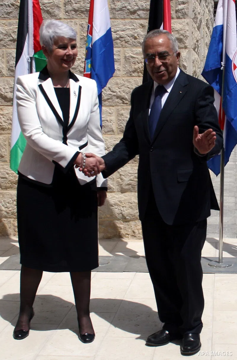 Palestinian Prime Minister Salam Fayyad and his Croatian counterpart Jadranka Kosor attend a joint press conference after their meeting in the West Bank city of Ramallah, on March 31, 2011. Photo by Issam Rimawi