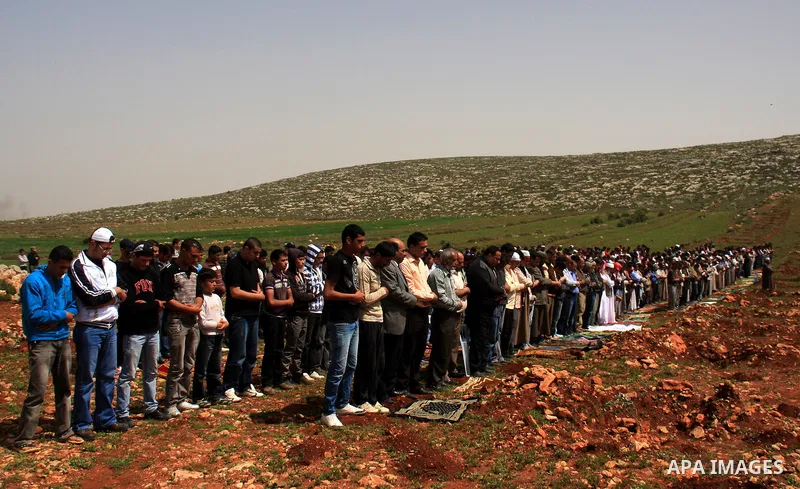 Palestinians perform Friday prayers on an open field in the village of Qusra, near the Jewish settlement of Shilo, in the Israeli-occupied West Bank, on April 1, 2011. Photo by Wagdi Eshtayah