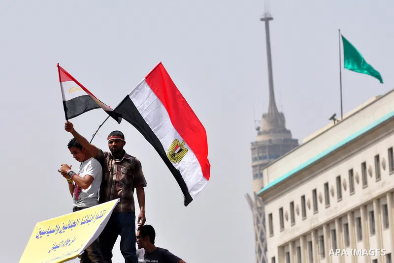 Egyptian protesters participate in a demonstration at the Tahrir square in Cairo, Egypt, Friday, April 1,2011, to call for Egypt's military government to harshly punish members of ex-President Hosni Mubarak's former admi...