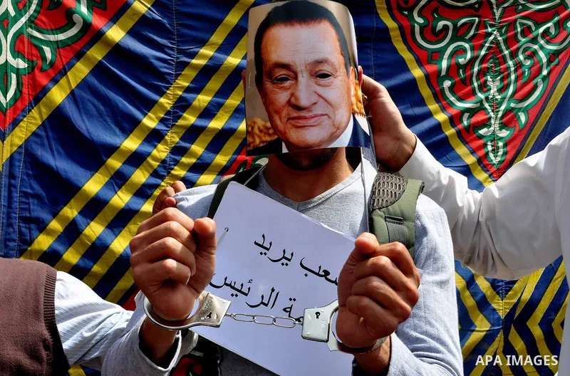 Egyptian protesters participate in a demonstration at the Tahrir square in Cairo, Egypt, Friday, April 1,2011, to call for Egypt's military government to harshly punish members of ex-President Hosni Mubarak's former admi...