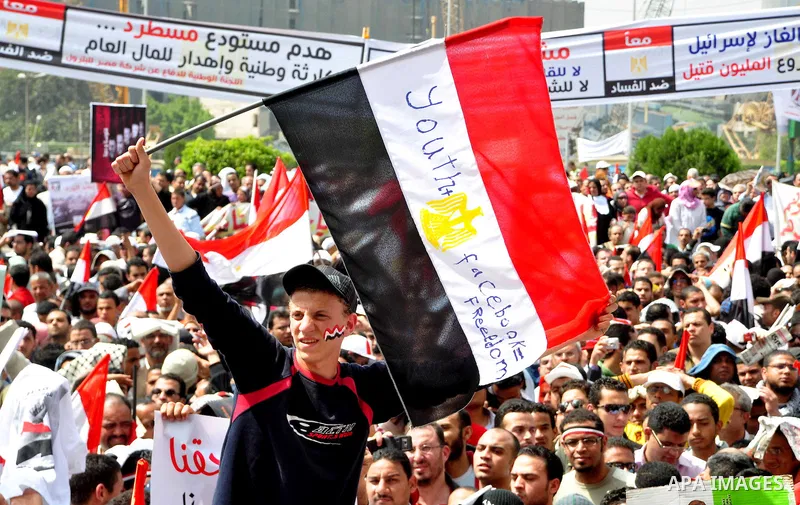 Egyptian protesters participate in a demonstration at the Tahrir square in Cairo, Egypt, Friday, April 1,2011, to call for Egypt's military government to harshly punish members of ex-President Hosni Mubarak's former admi...