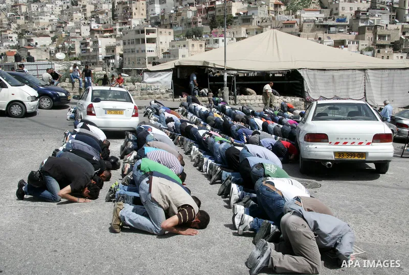 Palestinians attend Friday prayers at the protest tent in the Silwan neighborhood in East Jerusalem on 01 April 2011 as Palestinian protesters gather for a demonstration. A few stones were thrown and a few rounds of tear...