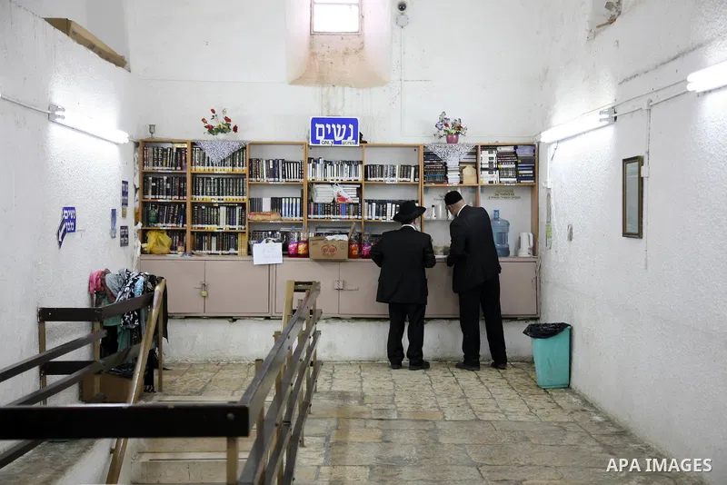 An Orthodox Jewish men stand inside a part of a mosque in the Village of the Prophet Samuel, which has been converted into a Jewish synagogue on April 1,2011. Photo by Sliman Khader.