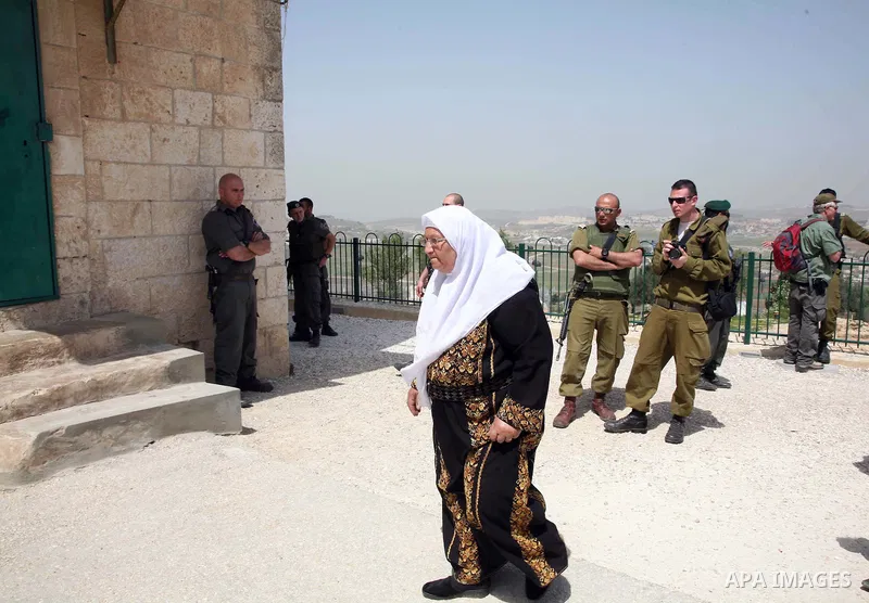 A Palestinian woman walks in her way to a mosque in the Village of the Prophet Samuel, which has been converted into a Jewish synagogue on April 1,2011. Photo by Sliman Khader.