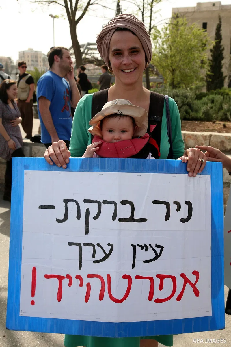 Left-wing activists take part in the weekly protest to show solidarity with Palestinians against a Jewish settlement in the Sheikh Jarrah neighbourhood in East Jerusalem April 1, 2011. Photo by Sliman Khader..
