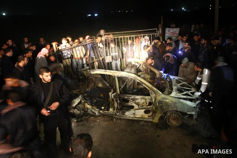 Palestinian Hamas officers inspect a vehicle following an Israeli airstrike that killed three of Hamas militants near Deir Al Balah, central Gaza Strip, early Saturday, April 2, 2011. Israeli aircraft killed the militant...
