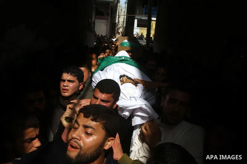 Palestinians carry the bodies of Hamas militants Ismail Lubbad and Abdallah Lubbad, two brothers killed earlier in an Israeli airstrike, during their funeral in Shati refugee camp in Gaza City, Saturday, April 2, 2011. I...