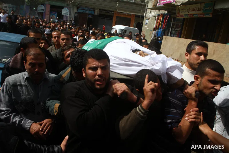 Palestinians carry the bodies of Hamas militants Ismail Lubbad and Abdallah Lubbad, two brothers killed earlier in an Israeli airstrike, during their funeral in Shati refugee camp in Gaza City, Saturday, April 2, 2011. I...