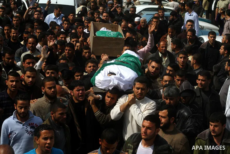 Palestinians carry the bodies of Hamas militants Ismail Lubbad and Abdallah Lubbad, two brothers killed earlier in an Israeli airstrike, during their funeral in Shati refugee camp in Gaza City, Saturday, April 2, 2011. I...