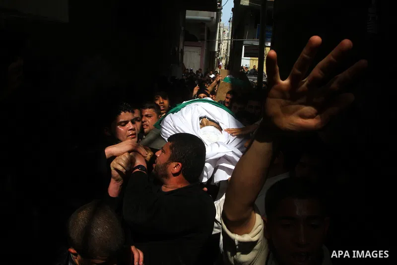 Palestinians carry the bodies of Hamas militants Ismail Lubbad and Abdallah Lubbad, two brothers killed earlier in an Israeli airstrike, during their funeral in Shati refugee camp in Gaza City, Saturday, April 2, 2011. I...