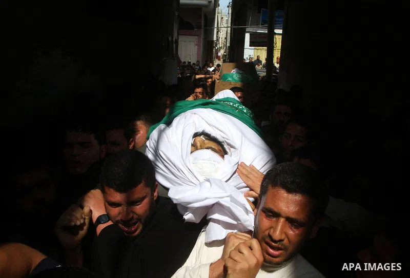 Palestinians carry the bodies of Hamas militants Ismail Lubbad and Abdallah Lubbad, two brothers killed earlier in an Israeli airstrike, during their funeral in Shati refugee camp in Gaza City, Saturday, April 2, 2011. I...