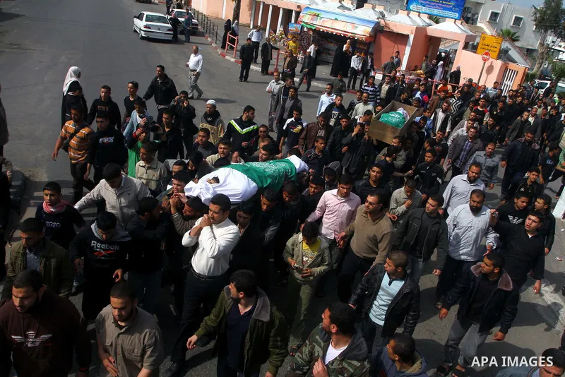Palestinians carry the bodies of Hamas militants Ismail Lubbad and Abdallah Lubbad, two brothers killed earlier in an Israeli airstrike, during their funeral in Shati refugee camp in Gaza City, Saturday, April 2, 2011. I...