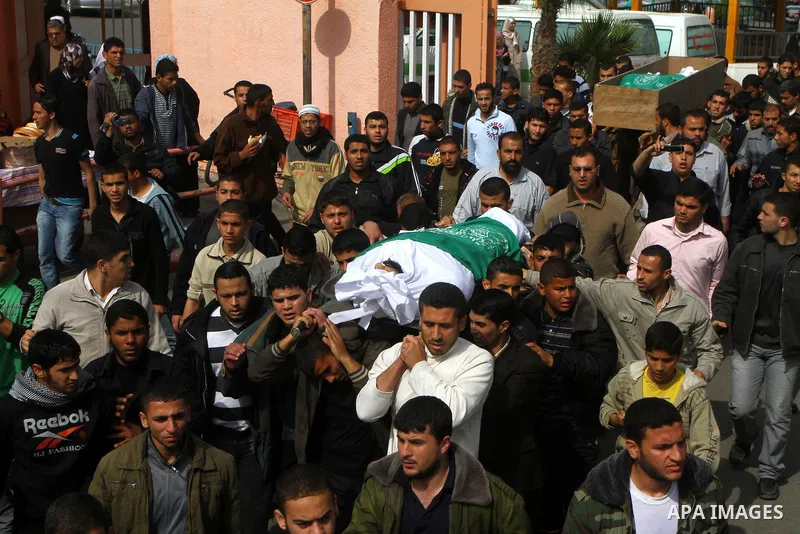 Palestinians carry the bodies of Hamas militants Ismail Lubbad and Abdallah Lubbad, two brothers killed earlier in an Israeli airstrike, during their funeral in Shati refugee camp in Gaza City, Saturday, April 2, 2011. I...