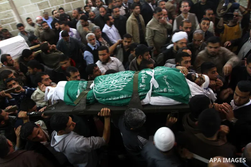 Palestinians carry the bodies of Hamas militants in Al-Omari Mosque during their funeral in Gaza City April 2, 2011. Israeli aircraft killed three Palestinian gunmen in the southern Gaza Strip early on Saturday, medical...