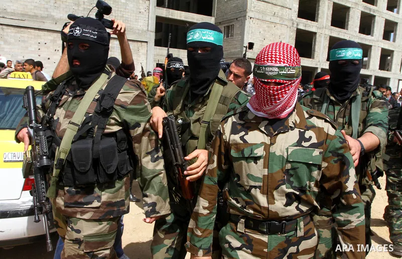 Masked Palestinian militants from various groups, including the Islamic Hamas movement, attend a press conference in Gaza City, Sunday, April 3, 2011. Israel warned its citizens in Egypt's Sinai Peninsula to evacuate imm...