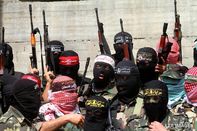 Masked Palestinian militants from various groups, including the Islamic Hamas movement, attend a press conference in Gaza City, Sunday, April 3, 2011. Israel warned its citizens in Egypt's Sinai Peninsula to evacuate imm...