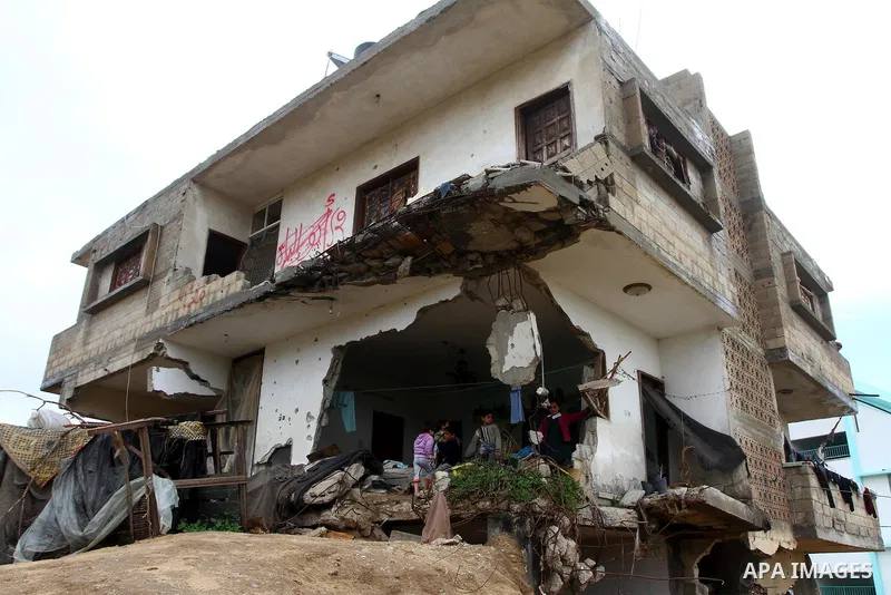 Palestinian children play on a destroyed building in Beit Lahia, damaged during the 22-day Israeli offensive on the Gaza Strip, on April 4, 2011, a day after Israel demanded that the United Nations bin a report critical...