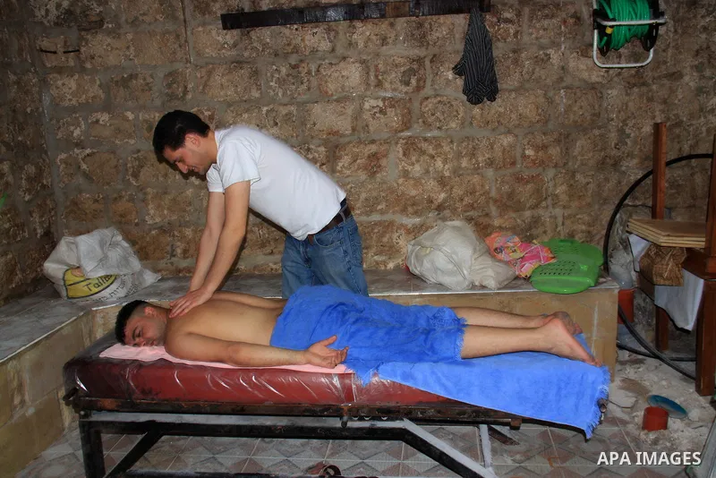 Palestinians enjoy steam bath at the 400-year-old traditional Turkish bath ''Hamam Alshefa'' in the West Bank City of Nablus on April 3,2011. Photo by Wagdi Eshtayah