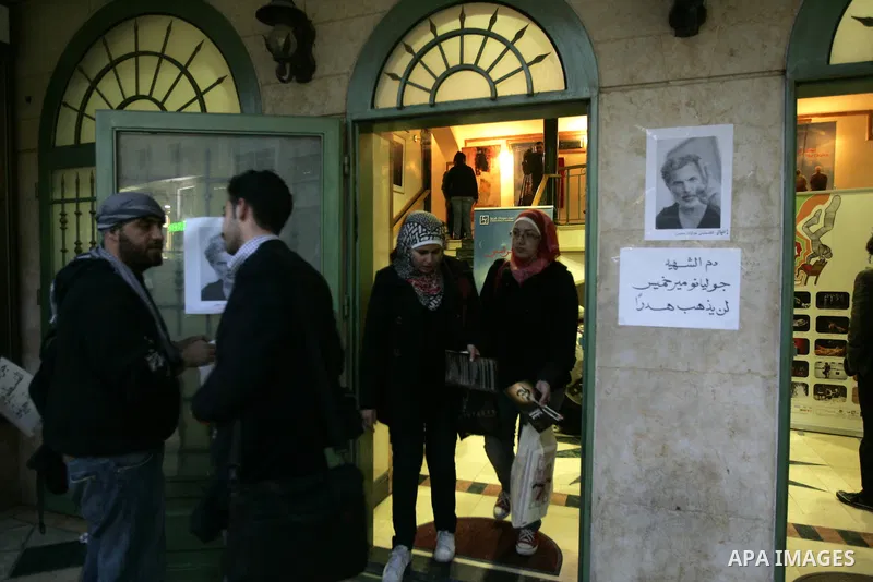 Palestinians hold posters depicting Israeli actor and director, Juliano Mer Khamis, during a protest in the West Bank city of Ramallah April 4, 2011. A masked gunman shot dead on Monday the well-known Israeli actor and d...