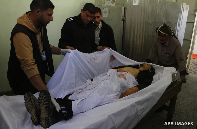 Palestinian relatives of Mohammed Shalha, 22-years-old gather around his body inside the morgue at a hospital in Gaza City on April 5, 2011. Palestinian medical officials said they had found the body in the north of Gaza...