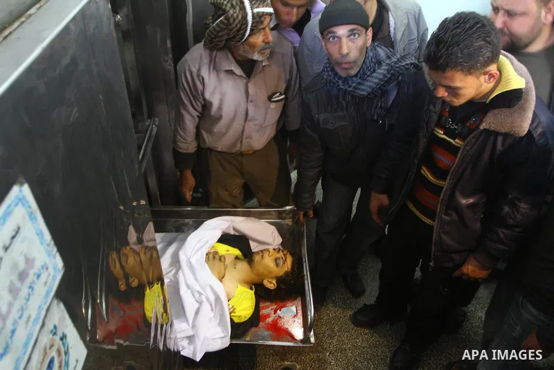 Palestinian relatives of Mohammed Shalha, 22-years-old gather around his body inside the morgue at a hospital in Gaza City on April 5, 2011. Palestinian medical officials said they had found the body in the north of Gaza...