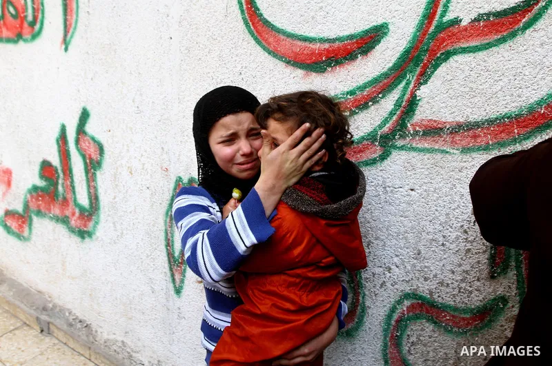 Relatives of Palestinian Mohammed Shalha react during his funeral in Jebaliya refugee camp, northern Gaza Strip, Tuesday, April 5, 2011. Palestinian authorities said that Shalha, 21, was killed by Israeli fire along Gaza...