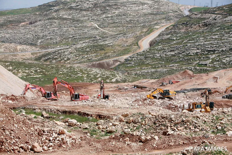 Israeli bulldozers work in the jewish settlement of Pisgat Zeev in East Jerusalem, Tuesday, April 5, 2011. A group of prominent Israelis is presenting an informal new peace proposal, hoping to breathe life into deadlocke...
