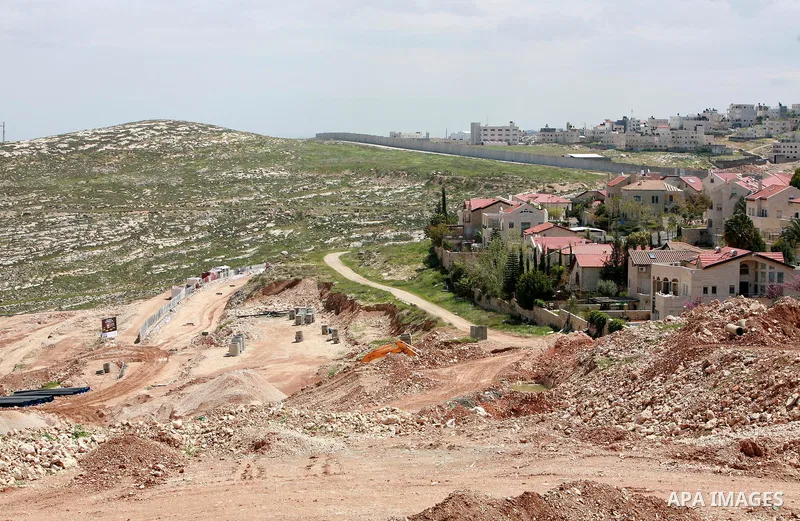 Israeli bulldozers work in the jewish settlement of Pisgat Zeev in East Jerusalem, Tuesday, April 5, 2011. A group of prominent Israelis is presenting an informal new peace proposal, hoping to breathe life into deadlocke...